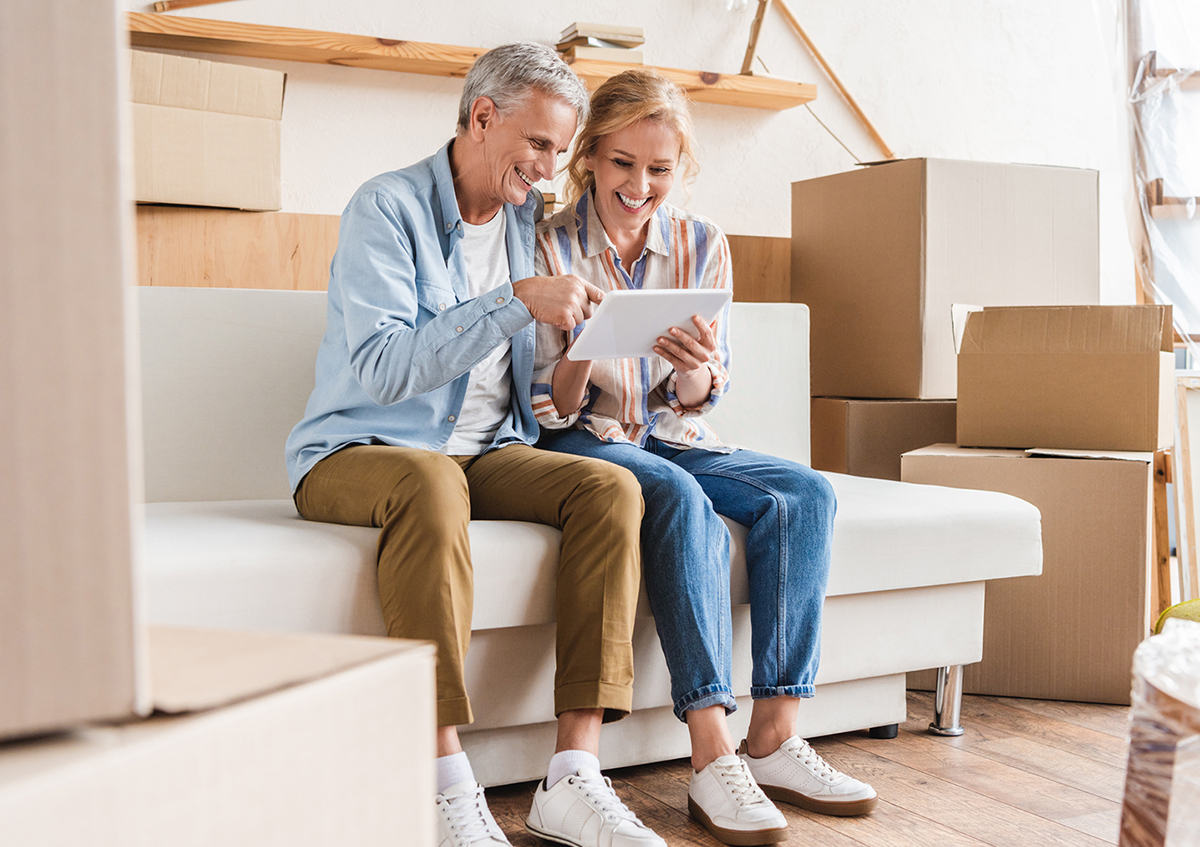 Couple using a tablet to view their home inspection report