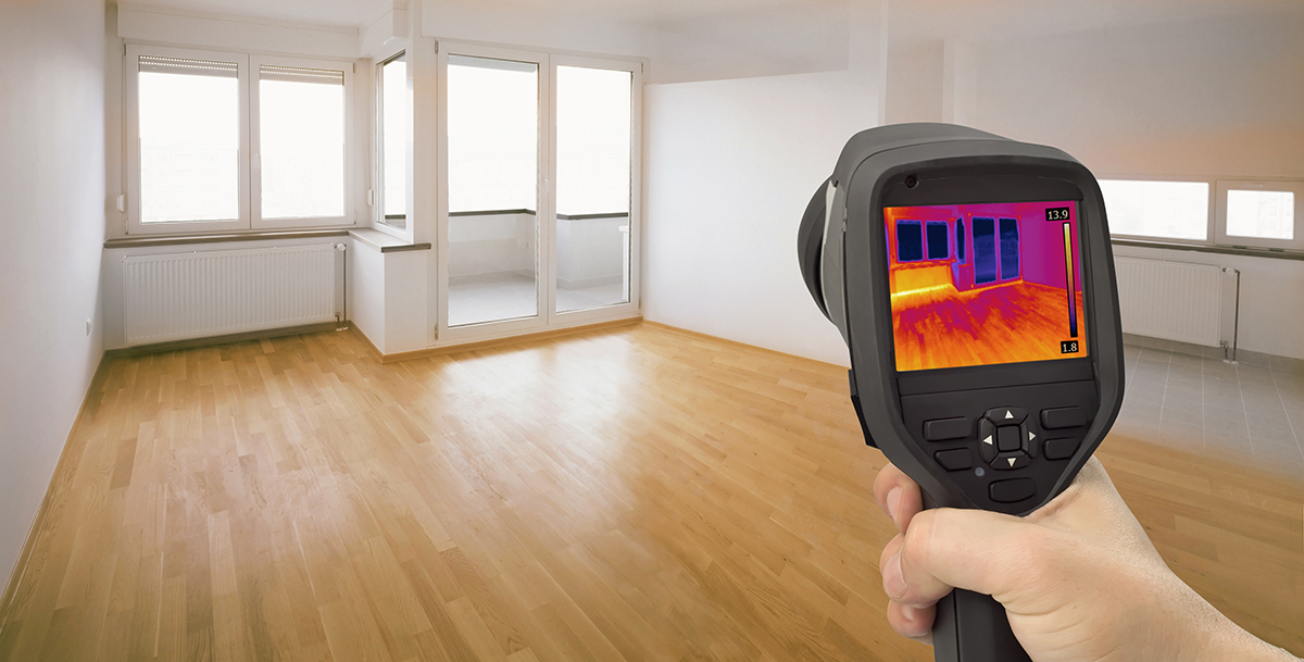 Thermal imaging device being used by our home inspectors to detect heat leaking thru windows